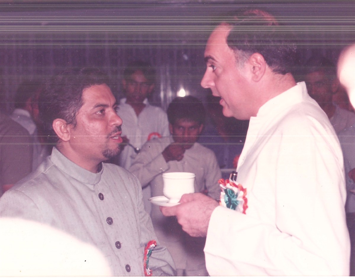 With Prime Minister Rajiv Gandhi over tea at a function
